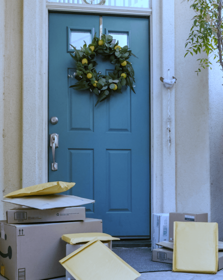 Blue front door with package on doorstep